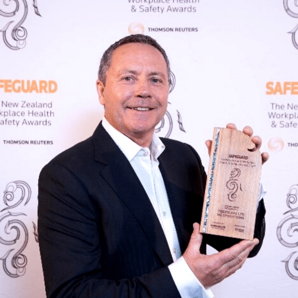 Ed Chignell holding Safeguard Health and Safety Award